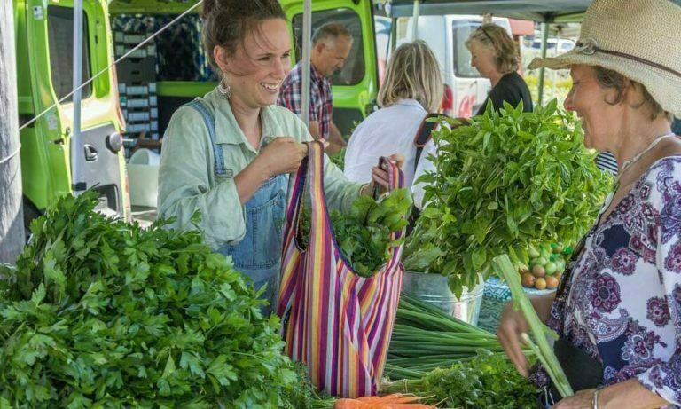 A woman selling vegetables in Bermi Market