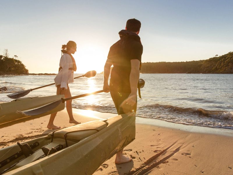 A woman and Man going on a paddleboarding